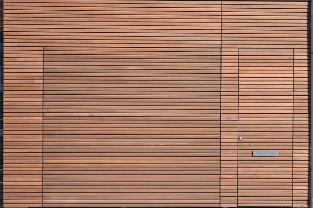 Wood Collection : solid wood facade cladding in venti with sectional door and front door