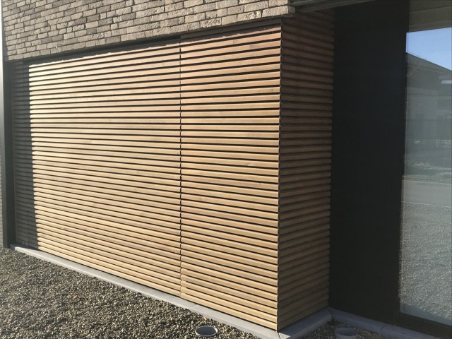 Wood Collection : solid wood facade cladding in venti with sectional door 